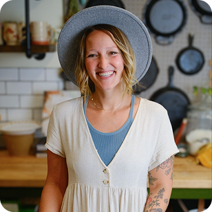 Jill standing in her kitchen smiling at the camera